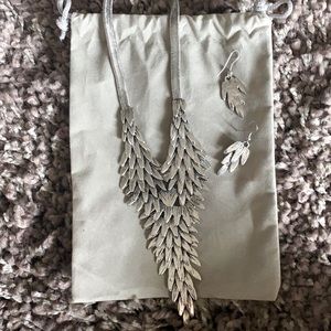 Beautiful silver necklace and earrings set.